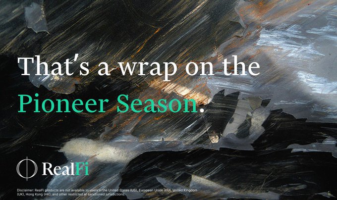 A promotional graphic with dark painted brushstrokes displays the text 'That's a wrap on the Pioneer Season.' along with the RealFi logo and a disclaimer that products are unavailable in the US, EU, and UK.