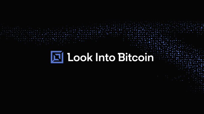 The image displays the "Look Into Bitcoin" logo on a black background with a blue particle wave pattern, visually reinforcing the post's announcement of the platform's return to its original lookintobitcoin.com name after two years operating as Bitcoin Magazine Pro.