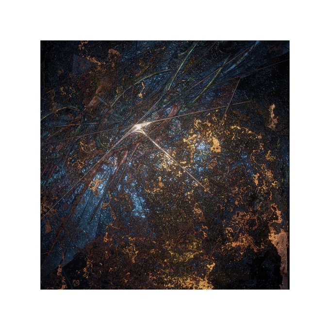A dark, abstract digital artwork featuring deep blue and gold textures with sharp linear elements radiating from a central bright point, evoking an atmospheric, otherworldly scene. It serves as the visual companion to the post announcing "Residents" as part of a digital expressionism collection launching live on @Ninfa_io on 30.07.2026.