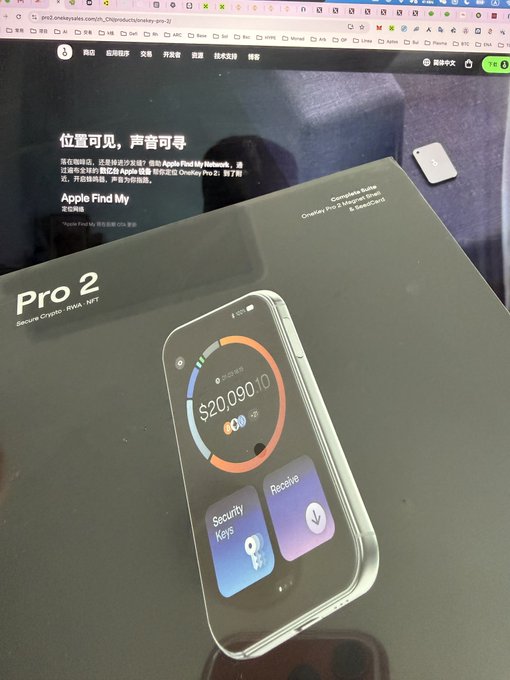 A photo showing the OneKey Pro 2 hardware wallet box, with the Twitter/X post in the background discussing how its October 8th release timing coincided with the Ledger user theft incident disclosed on October 9th, suggesting possible connection.