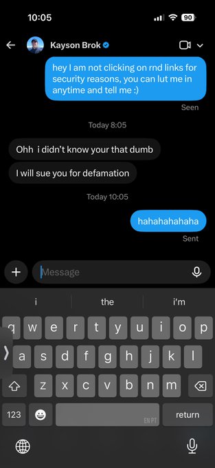 A screenshot of an iMessage conversation with Kayson Brok where the user explains they can't click random links for security reasons, followed by a threatening reply 'I will sue you for defamation' and a laughing response.
