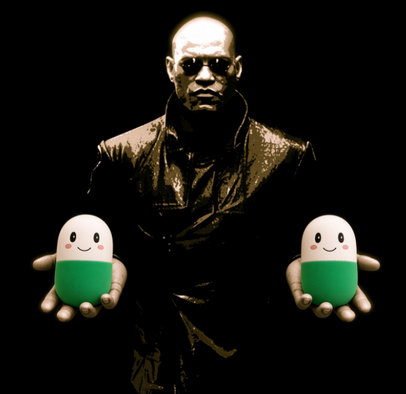 A man in a dark trench coat and sunglasses stands against a black background, holding out two identical smiling green and white capsule-shaped characters in his hands.