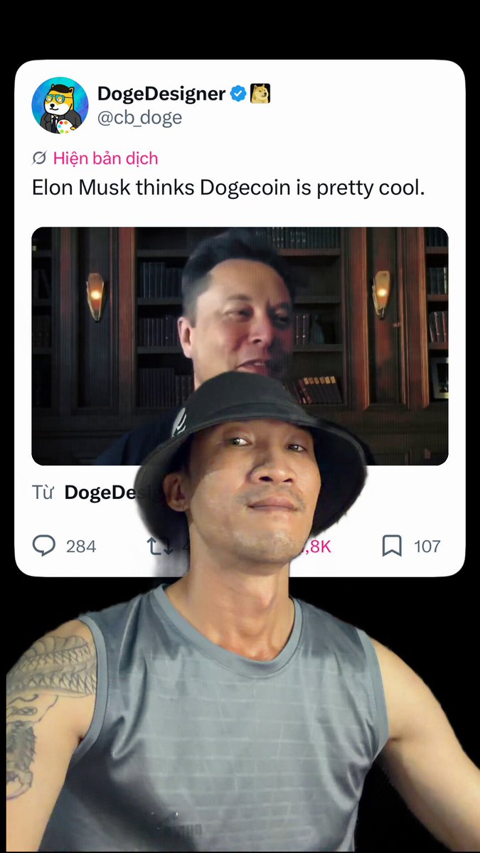 The image features a man wearing a gray tank top with a black bucket hat, standing against a black background. In front of him, there's a picture of another person wearing a black hat and a sign that says "Elon Musk likes Dogecoin humor...". The main subject in the image is the man wearing the gray tank top and the black bucket hat.