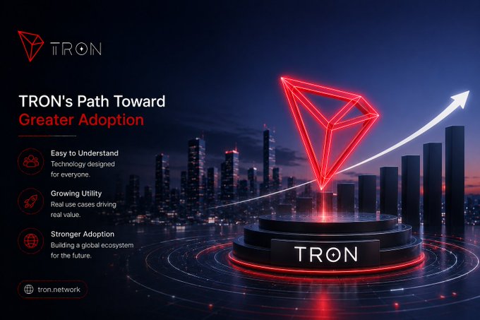 A promotional graphic for the TRON cryptocurrency network titled 'TRON's Path Toward Greater Adoption,' featuring a glowing red TRON logo above a podium with a rising arrow over a city skyline, listing benefits like 'Easy to Understand,' 'Growing Utility,' and 'Stronger Adoption' with the URL tron.network.