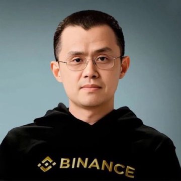 A man with glasses and short dark hair wears a black hoodie displaying the "BINANCE" logo in gold, appearing to be a corporate portrait associated with the cryptocurrency exchange.

The image relates to the post by likely showing a Binance executive (such as founder Changpeng Zhao), connecting his role at the exchange that purchased $1 billion in Bitcoin for the "SAFU Fund," now valued at over $1.27 billion with significant unrealized gains.