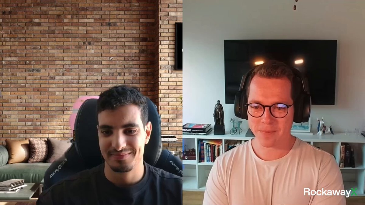 The image shows two men sitting next to each other in front of a television screen displaying a video call with another person. The man on the left side of the frame has his arms crossed over his chest, while the man on the right side is smiling at the camera. They are both wearing headphones and appear to be engaged in a conversation or watching something together.

The background features a brick wall and a flat-screen TV mounted above it. There are also several books scattered around the room, indicating that this space might serve as a living area or a study. The image is accompanied by a caption that reads "Our new OnRe Core Vault on @AccountableData is a single access point for a blended USDC return profile capturing @onrefinance ecosystem yields. We spoke with @GilgameshODs to explore how the vault is set up, institutional demand for ONyc, and more:".