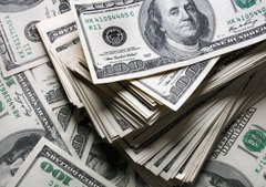 A close-up view of stacks and fanned-out U.S. $100 bills, prominently showing the serial number "KA 03054957 K" and the distinctive portrait of Benjamin Franklin.

The image of $100 bills visually reinforces the post's discussion of the U.S. dollar reaching historic highs against the 47 level, symbolizing the liquidity operations and dollar strength tied to post-NATO summit Treasury actions that the post claims the media has overlooked.