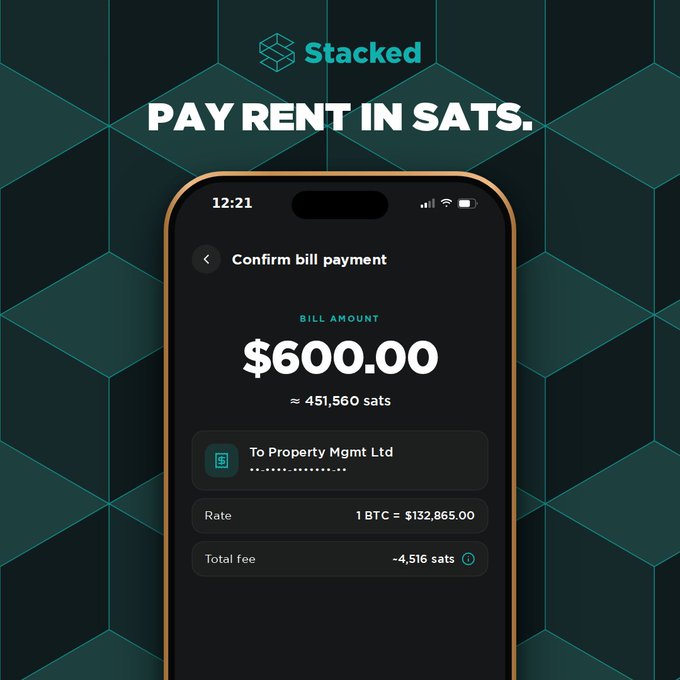 A mobile app advertisement for 'Stacked' featuring a phone screen showing a bill payment confirmation of $600.00 (≈451,560 sats) to 'Property Mgmt Ltd' with a rate of 1 BTC = $132,865.00 and a total fee of ~4,516 sats, under the headline 'PAY RENT IN SATS.'