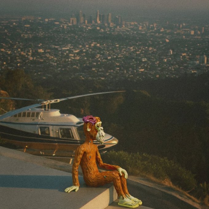 An orange-furred monkey-like creature wearing pink sunglasses sits on a ledge overlooking a sprawling city skyline, with a private helicopter parked behind it.