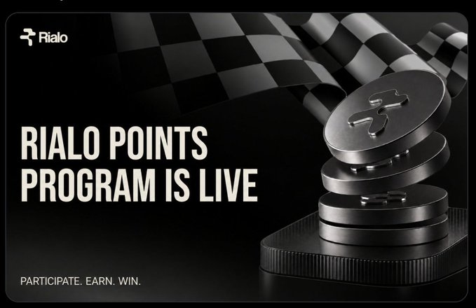 Promotional banner announcing "RIALO POINTS PROGRAM IS LIVE" featuring stacked Rialo coins on a checkered flag, tagged with "PARTICIPATE. EARN. WIN."—visually emphasizing the launch of the Rialo point system highlighted in the post.