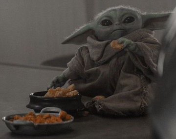 Grogu (the "baby Yoda" character from *The Mandalorian*) sits on the ground in his signature oversized robe, happily eating crispy fried food from small bowls. The post's playful nickname "Sitting Grok" riffs on this very scene of him looking adorably round and content as he snacks, capturing his chunky, cherubic appearance in the moment.
