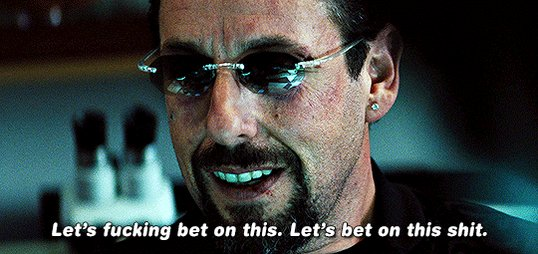A close-up of actor Adam Sandler wearing reflective sunglasses, with the subtitle: “Let’s fucking bet on this. Let’s bet on this shit.”