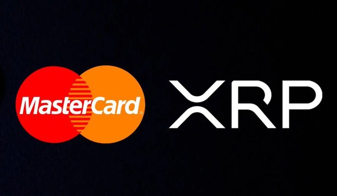 The image displays the MasterCard logo alongside the XRP ticker on a black background. It visually reinforces the news that Mastercard is participating in the XRP Ledger Hackathon in New York on October 24–25.