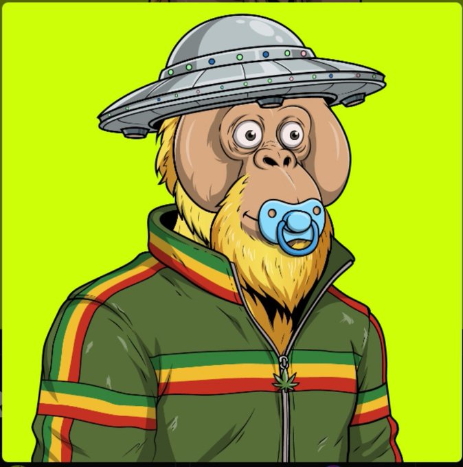 A cartoon illustration shows a chimpanzee-like character with a blonde beard, wearing a green tracksuit with red and yellow stripes and a metallic UFO-shaped hat, while holding a pacifier in its mouth.