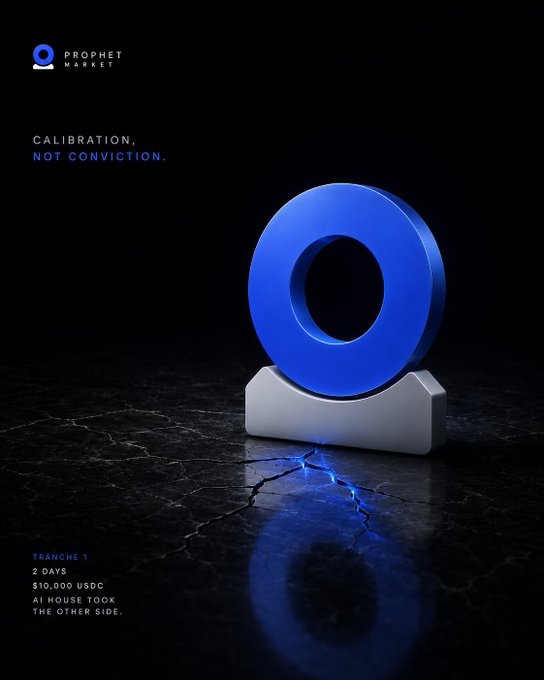 The image features a blue circle with a silver base sitting on a black surface. The background is dark, which contrasts with the bright blue color of the circle. There are no texts or other objects present in the image.
