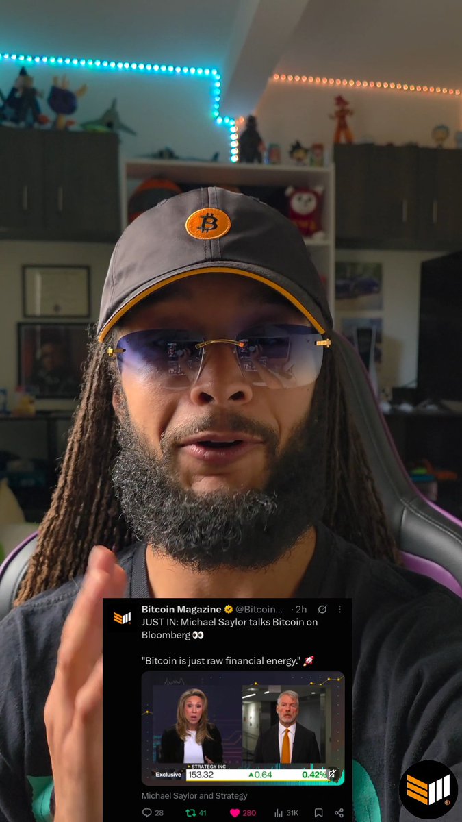 A man with dreadlocks, a beard, and a Bitcoin-themed cap discusses a Bitcoin Magazine tweet showing Michael Saylor on Bloomberg, where he is quoted saying 'Bitcoin is just raw financial energy,' with BTC price showing around $153.32.