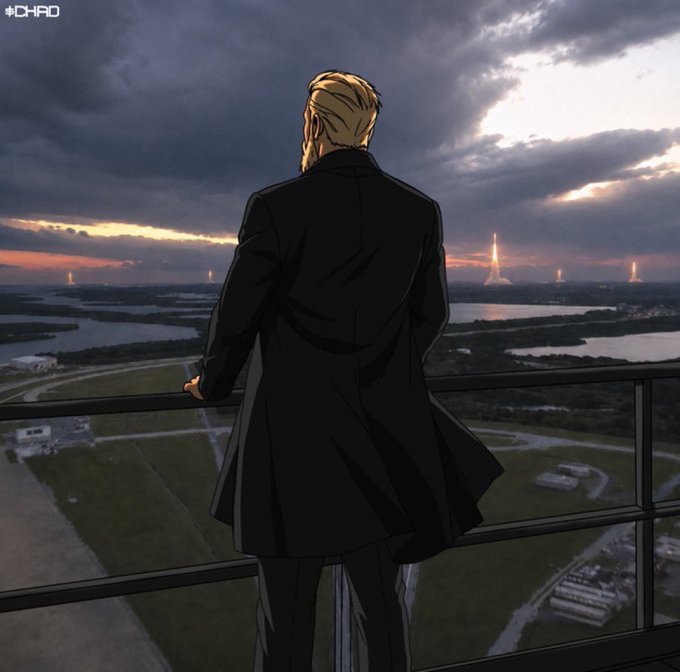 An illustrated scene shows a blonde, bearded man in a long black coat standing on a balcony, looking out over a sprawling landscape at sunset with tall spires visible in the distance.