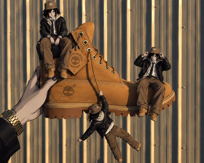 An anime-style illustration shows three miniature figures in black jackets and bucket hats posing on a giant Timberland-style work boot held by a hand wearing a gold watch, set against a corrugated metal wall.