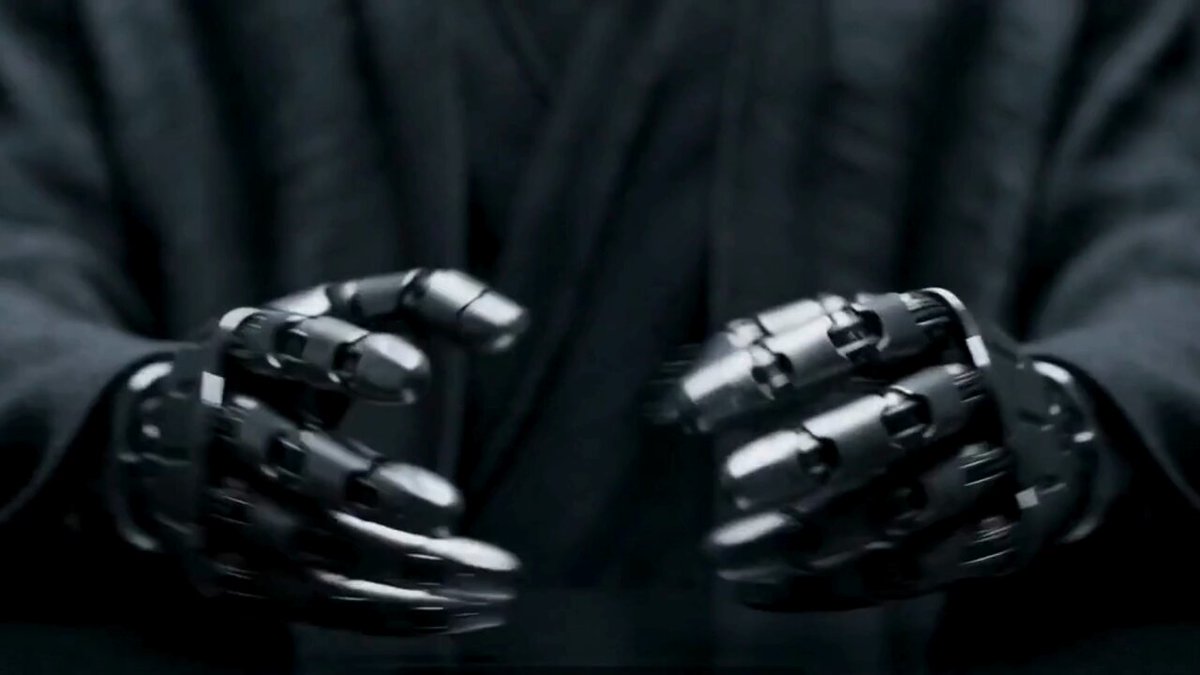In the image, there are two hands with black gloves that resemble humanoid robots. The hands are holding up a small robot, which is likely an image of one's own creation. This scene suggests that the person in the picture is interested in humanoid robots or has just created such a robot for a specific purpose. It might be related to a game or a DIY project involving the use of humanoid robots, as over 40% of all humanoid cards have already been claimed. To earn your rank in the DAO and claim this image, you should stake $DEUS and generate a wallet address that includes the name 'humanoid.cards'. The wallet address, along with the wallet's public key, will be sent to you shortly after staking.
