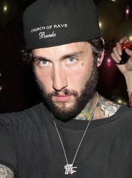 Ricky "FaZe Banks" Banks wears a black "Church of Rave" branded cap and a silver pendant necklace while staring directly at the camera, embodying the confident persona referenced in the post about his lucrative pivot into crypto entertainment.