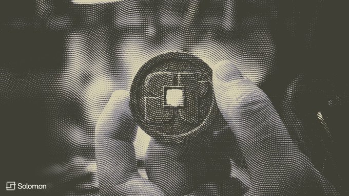 The image features a coin held up by someone's hand, which appears to be a silver coin with a white center. The background of the image is black and white, giving it an artistic feel. The text accompanying the image reads "Solomon has joined Superteam Black. USDv is being built with the best of @solana around us. Productive dollars are coming." This suggests that Solomon, a character from the movie "Superteam", has joined forces with the creators of the cryptocurrency project, Solidarity, to build a new digital currency called Bitcoin. The image also includes a watermark in the bottom right corner that reads "© @solana".