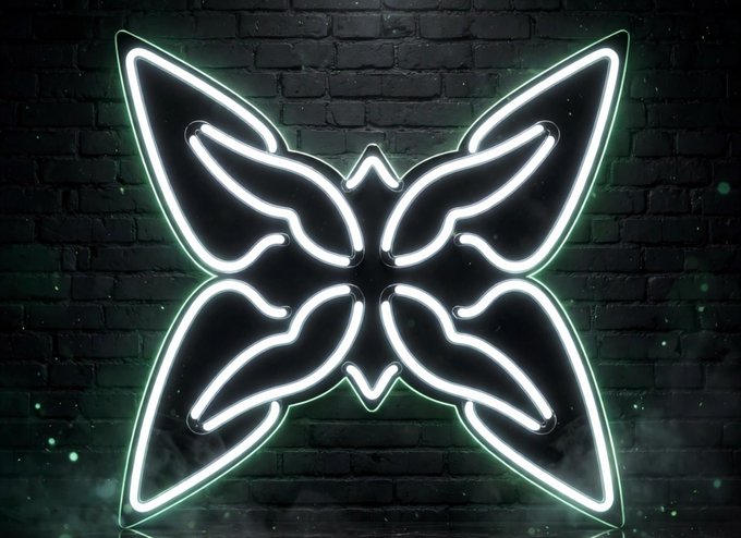 A neon green and white butterfly-shaped light fixture mounted against a dark brick wall background.