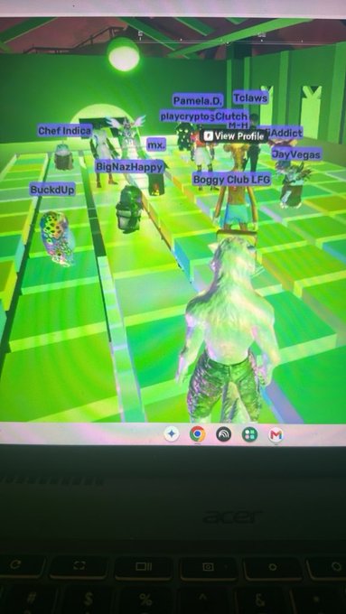 A photograph of an Acer laptop screen displaying a 3D game with green, distorted graphics and multiple player names like 'Chef Indica', 'BigNazHappy', and 'Boggy Club LFG' floating above characters.