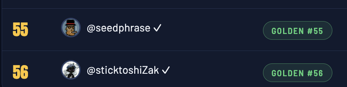 A screenshot showing two user entries, '@seedphrase' as GOLDEN #55 and '@sticktoshiZak' as GOLDEN #56, both with verification checkmarks.
