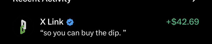 A dark-themed activity feed entry showing 'X Link' with a verified blue checkmark, accompanied by the quote 'so you can buy the dip.' and a green value of '+$42.69'.