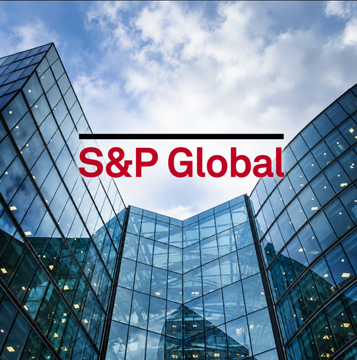 A corporate image featuring the 'S&P Global' logo in red text overlaid on a photograph of modern glass office buildings reaching toward a blue sky with white clouds.