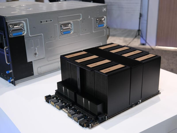 A rack-mounted server chassis sits behind a baseboard populated with multiple upright NVIDIA B300 GPU modules on a white display table, showcasing the hardware ready for deployment. The accompanying caption emphasizes that B300s are secured and the GLM-5.3 model will run across this infrastructure.
