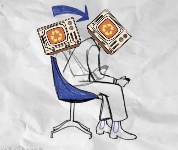 A crudely drawn sketch on crumpled paper showing a person sitting in a chair with a computer monitor for a head, with an arrow pointing to the same figure holding two more monitors.