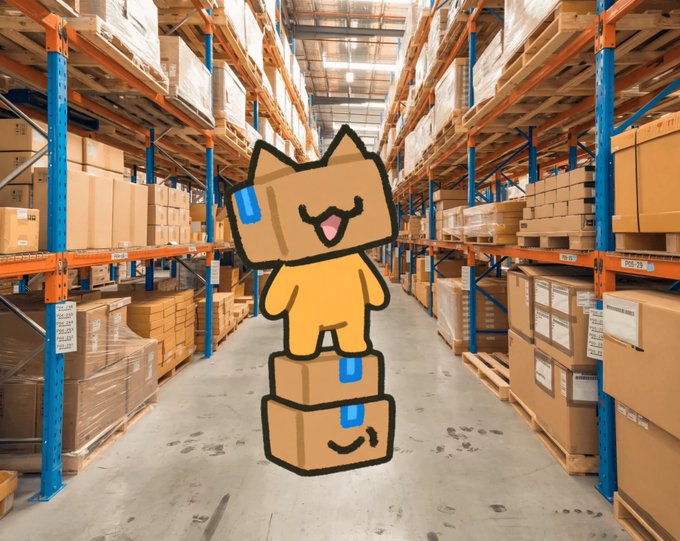 A cartoon cardboard box cat character standing on top of two shipping boxes with a happy expression, placed against a photographic background of a large warehouse filled with tall racks of cardboard packages.