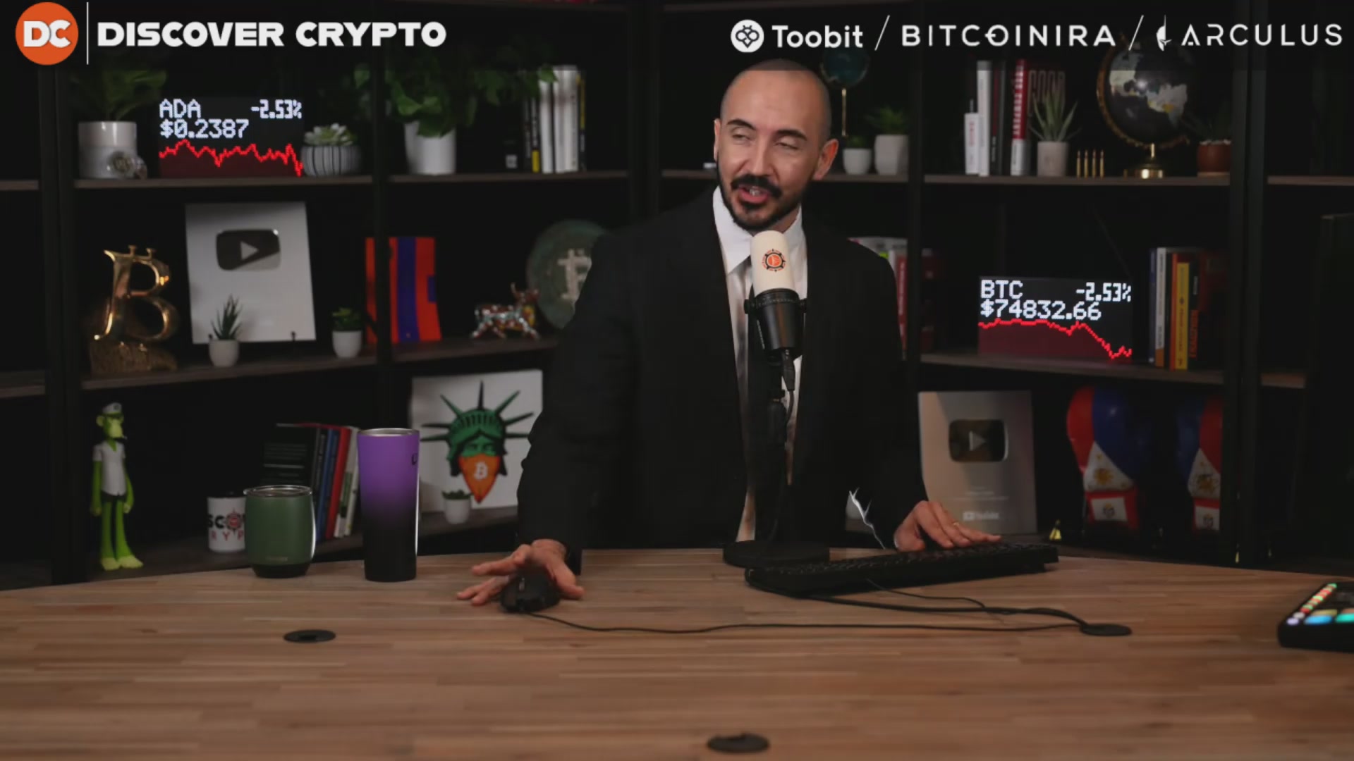 The image shows a man sitting at a desk with a computer, possibly working or giving a presentation. There are several books surrounding him, indicating that he might be researching or studying about cryptocurrency. The caption of the image reads "Is Ethereum Dead? (Time To Sell?)". This suggests that there is some discussion or analysis related to the performance and future of Ethereum in the post's context.