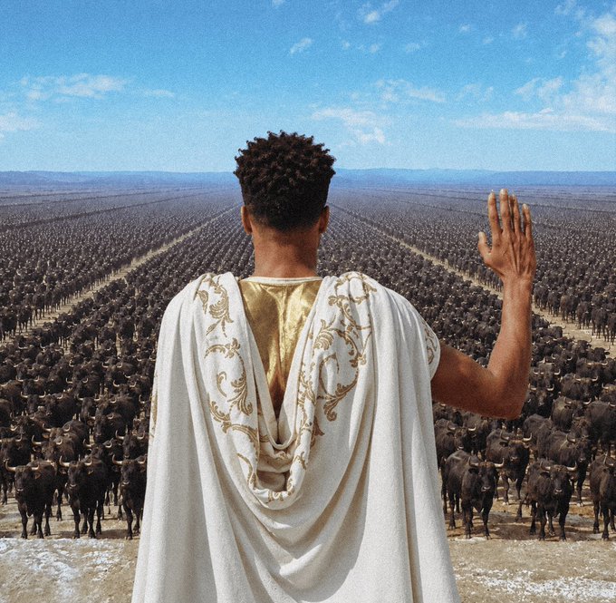 A scene depicting a Black figure wearing a golden and white ornate robe, viewed from behind with one hand raised, standing before a vast, seemingly endless herd of cattle stretching across a plains landscape.