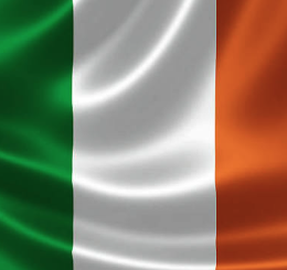 The image displays the Irish flag, featuring three vertical stripes of green, white, and orange with a subtle satin texture, directly symbolizing Ireland in the context of the post about Ireland unveiling stricter anti-money laundering (AML) rules for crypto transfers as part of its first national AML strategy through 2030.