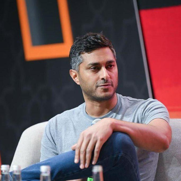 Arjun Sethi, co-CEO of crypto exchange Kraken, sits on stage during an event where he discussed the company's plans to expand banking services into Europe and pursue asset management partnerships.