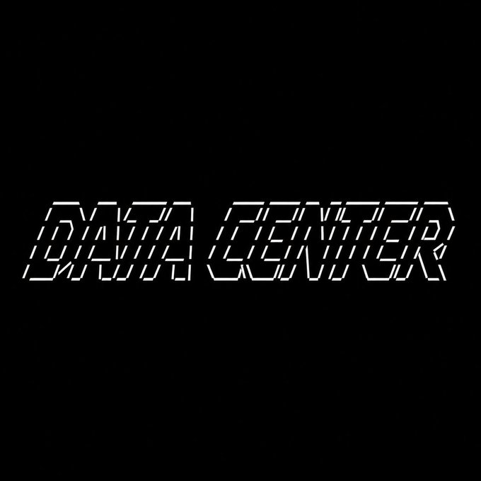 The text 'DATA CENTER' is displayed in a stylized, glowing white digital font against a solid black background.