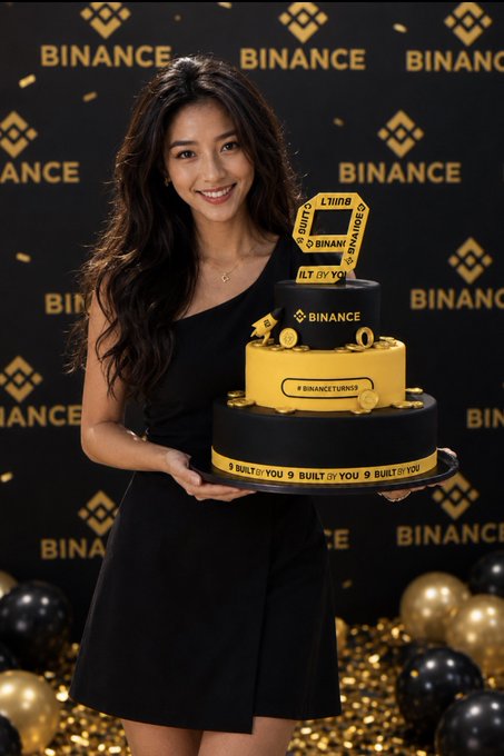 A woman in a black dress smiles while holding a tiered Binance anniversary cake featuring the text "9 BUILT BY YOU" and the hashtag "#BINANCETURNS9," celebrating Binance's 9th anniversary. The festive black and gold color scheme, balloons, and branded backdrop reinforce the celebratory milestone mentioned in her reflective post about her journey since registering with Binance in 2017.