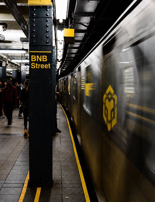 A subway train blurs past at the BNB Street station, marking the moment you've arrived at your destination.