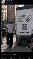 A screenshot of Kimchi’s X account shows a man walking past a wall poster advertising “project kimchi” with a QR code and an app-store badge. The post’s caption says Kimchi’s account was reportedly hacked and used to promote a $KIMCHI token, which reportedly surged to a $15 million valuation before the post was deleted.
