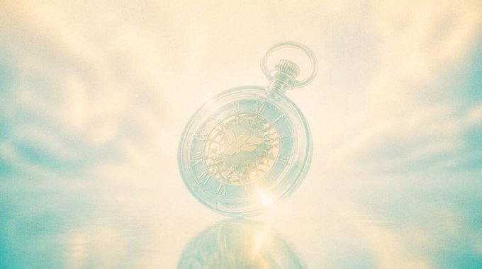 A transparent pocket watch with Roman numerals floats in a dreamy, cloudy sky with warm light filtering through.