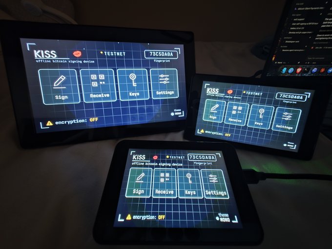 Three devices displaying the KISS offline bitcoin signing device interface with options for Sign, Receive, Keys, and Settings, all showing encryption: OFF.