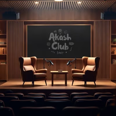 An interior view of a small auditorium or podcast studio with two chairs on a stage and a screen displaying 'Akash Club SACT' in chalk-like lettering.