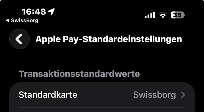 The image shows an iPhone screen displaying the Apple Pay default settings in German, with the SwissBorg card set as the "Standardkarte" (default card) under "Transaktionsstandardwerte." This relates to the post by highlighting the SwissBorg card's integration with Apple Pay, which extends its functionality to devices like the Apple Watch Ultra.