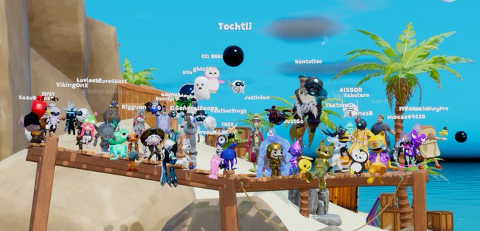 A group photo of avatars gathered on a wooden platform in Nifty Island, with usernames like "Tochtli," "SIXGOD," "PFFGAMEMagqro," and "Toadlair" floating above characters dressed as Sloth and various other figures. The image captures the close-knit community of Nifty Island players that the post is fondly remembering as the game prepares to go offline.