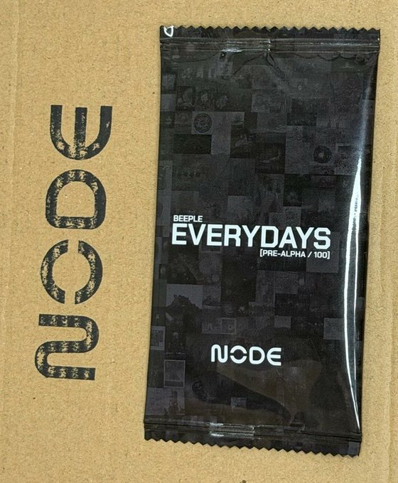 The image features a black and white label with the words "Nude Everydays" written on it, along with an image of a person's face. The background of the image is brown cardboard. The text on the label suggests that the product being sold is a gift card or token of appreciation for every sale made by the seller. This implies that the seller is giving away these tokens as a gesture of gratitude to their customers, and it encourages people to make purchases from them in return.