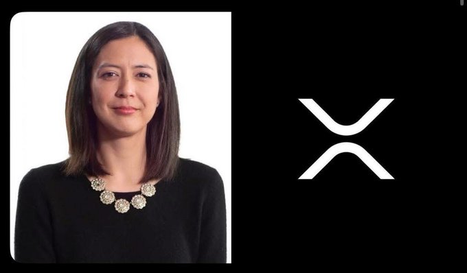 A woman wearing a black top poses for a picture with a "X" logo behind her. The background features a white color that appears to be part of an advertisement or promotional material related to Ripple, possibly introducing XRP as a beneficial service if even 1% of payment infrastructures moves on-chain. The image focuses on the woman and the logo, indicating their central role in the context provided by the post.