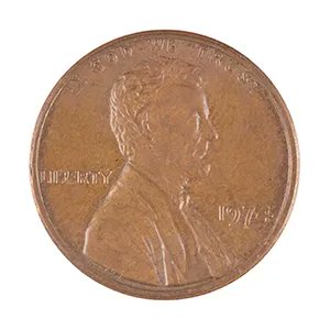 A close-up of a US Lincoln penny dated 1973, showing the profile of Abraham Lincoln and the inscriptions 'IN GOD WE TRUST', 'LIBERTY', and '1973'.
