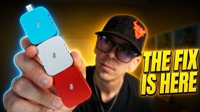 A man wearing a cap and glasses holds up three small Bitkey hardware devices in blue, white, and red, with the text "THE FIX IS HERE" displayed prominently on the right side of the image. The thumbnail-style graphic promotes a video discussing how Bitkey's key generation process lacks the transparency seen with Coldcard devices.